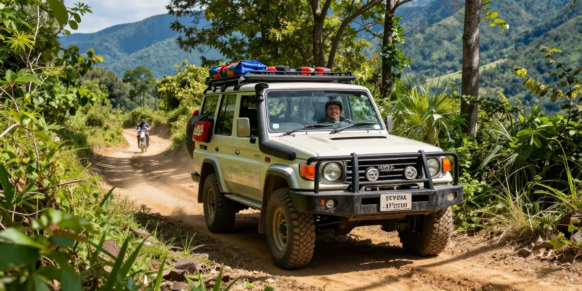 David Vepraskas Atlanta enjoying off-roading adventure in a Toyota Land Cruiser on a dirt trail with stunning mountain scenery.